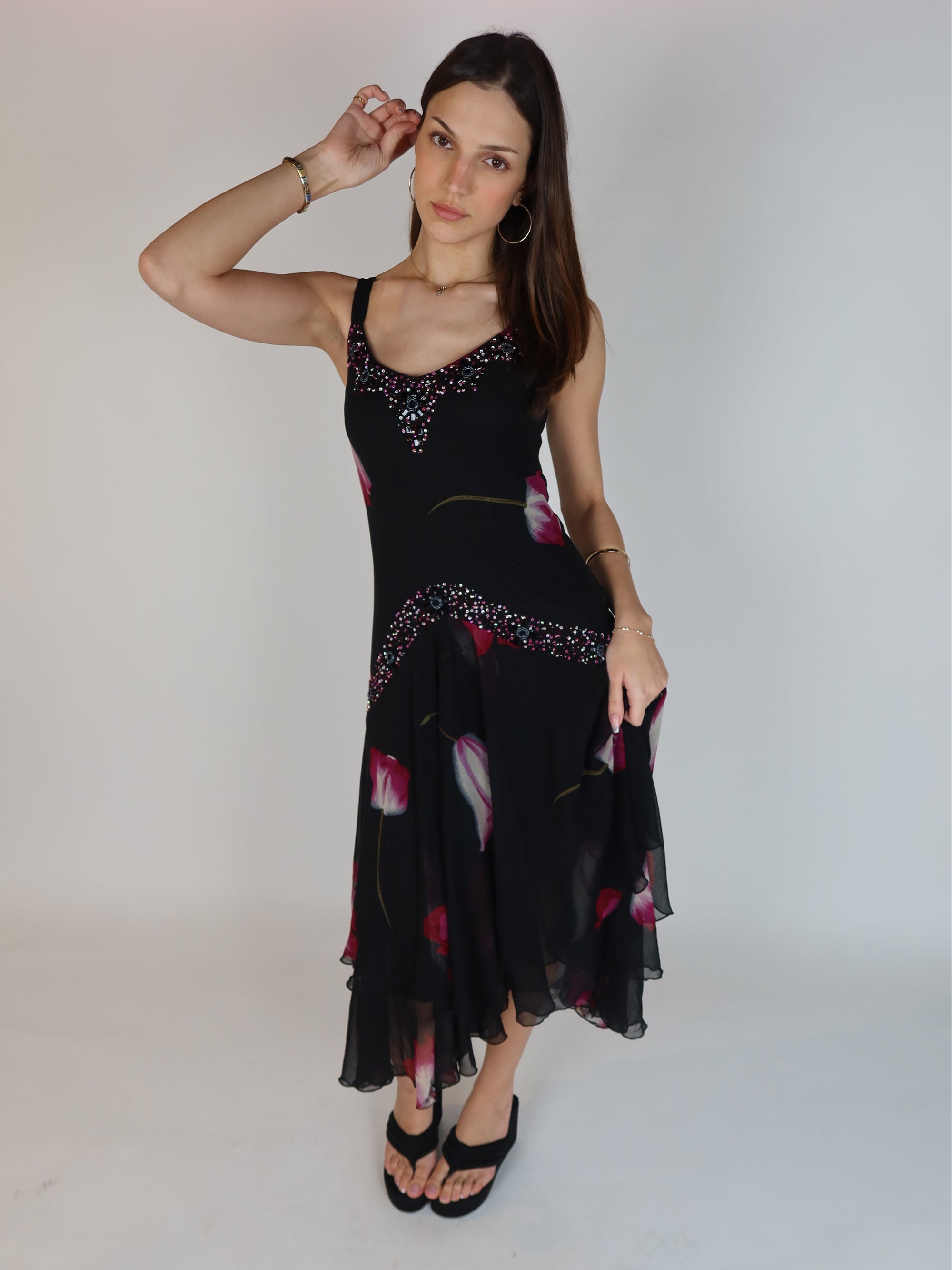 Vintage Y2K black floral chiffon midi dress with hand-beaded neckline, drop waist embellishments, and handkerchief hem skirt.