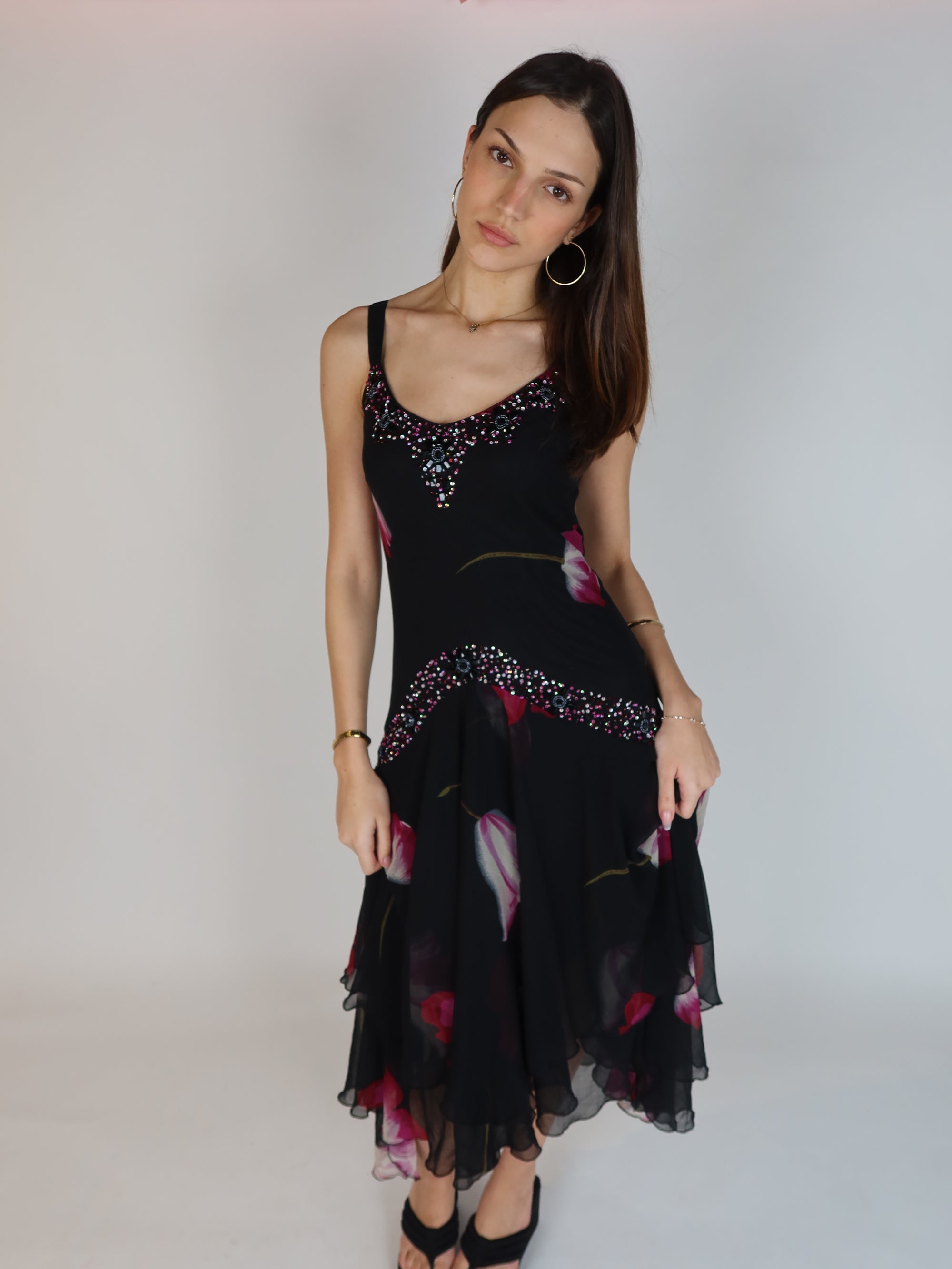 Vintage Y2K black floral chiffon midi dress with hand-beaded neckline, drop waist embellishments, and handkerchief hem skirt.