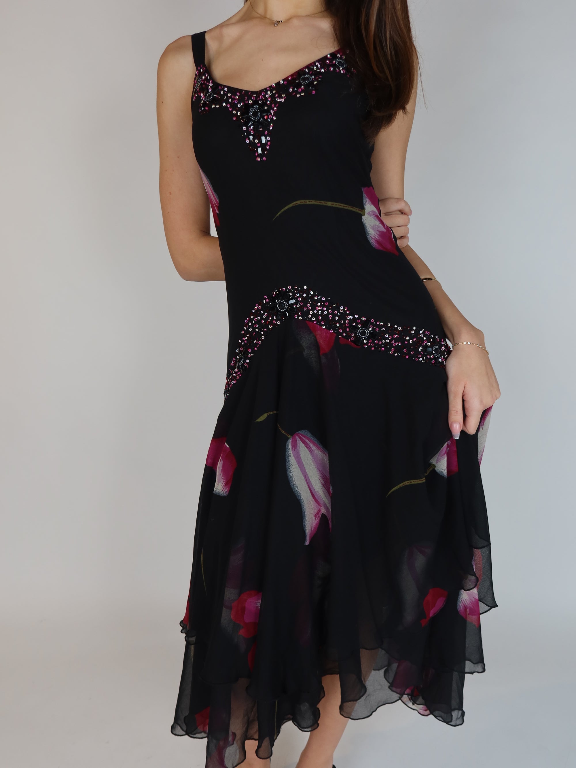 Vintage Y2K black floral chiffon midi dress with hand-beaded neckline, drop waist embellishments, and handkerchief hem skirt.
