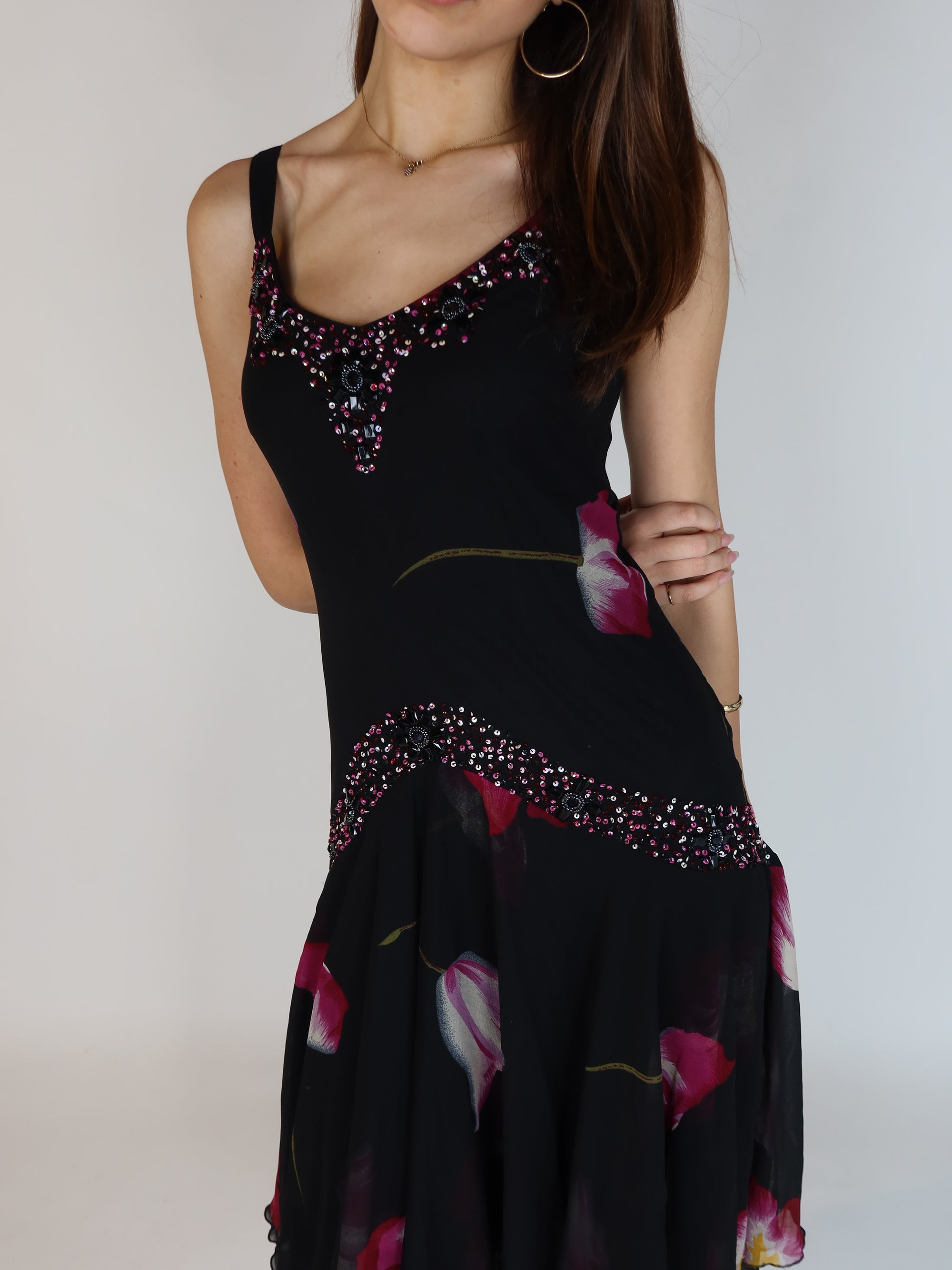 Vintage Y2K black floral chiffon midi dress with hand-beaded neckline, drop waist embellishments, and handkerchief hem skirt.