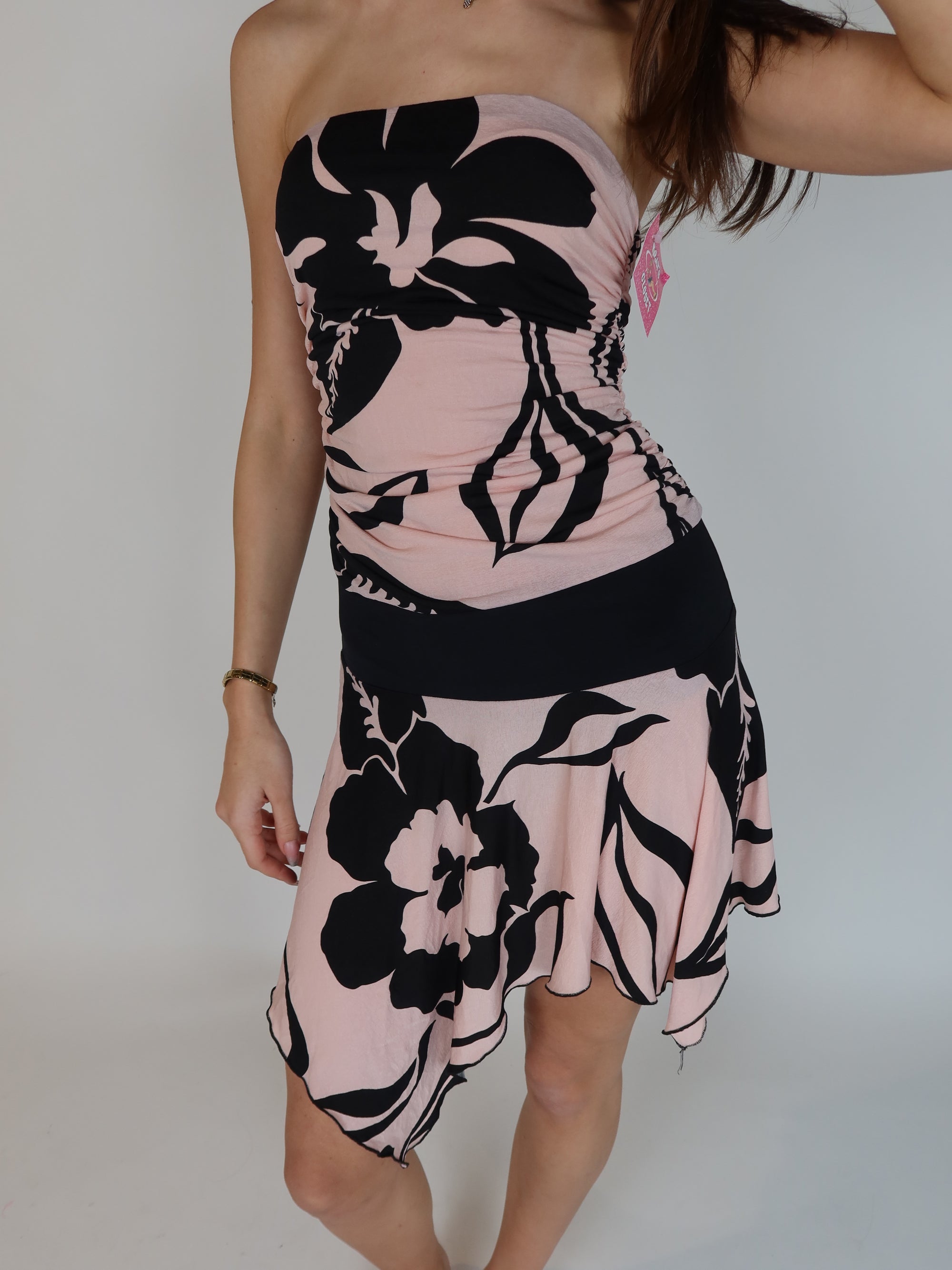 Vintage Y2K pink chiffon mini dress with paisley print details, pleated tiered skirt, shimmer overlay, and embellished sweetheart neckline.
