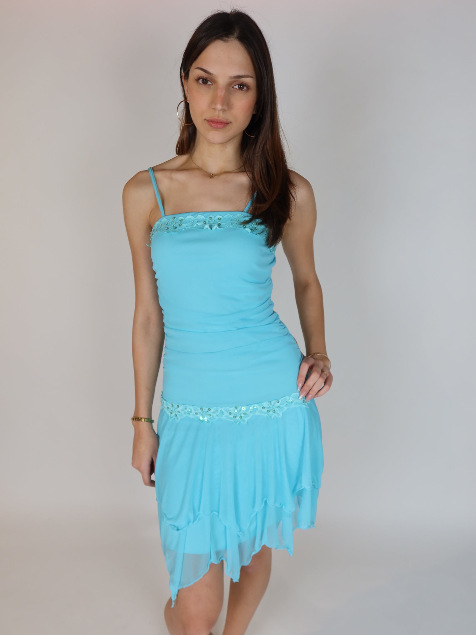 Vintage Y2K turquoise chiffon mini dress with beaded floral trim, sequin embellishments, spaghetti straps, and handkerchief hem skirt.