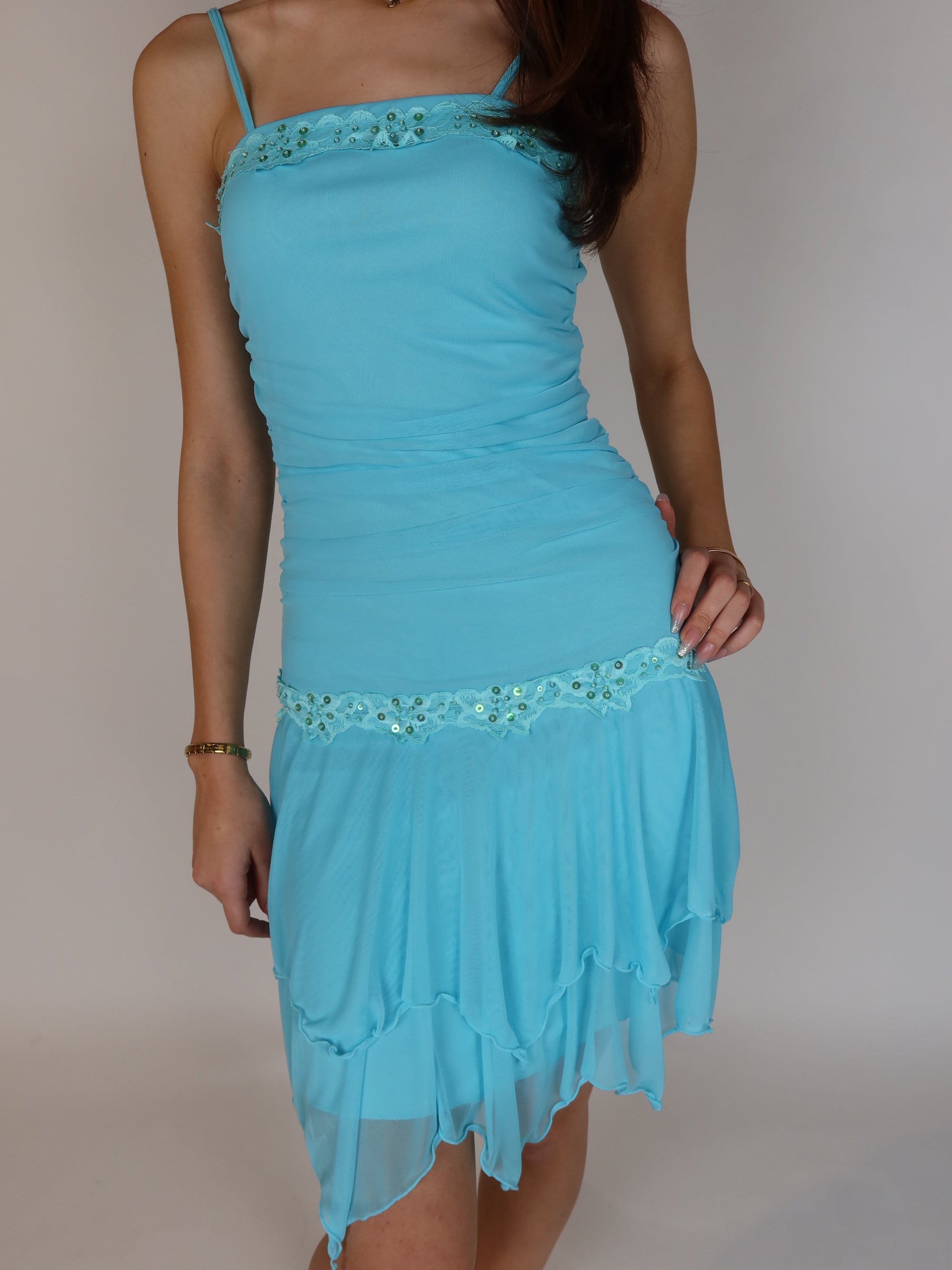 Vintage Y2K turquoise chiffon mini dress with beaded floral trim, sequin embellishments, spaghetti straps, and handkerchief hem skirt.