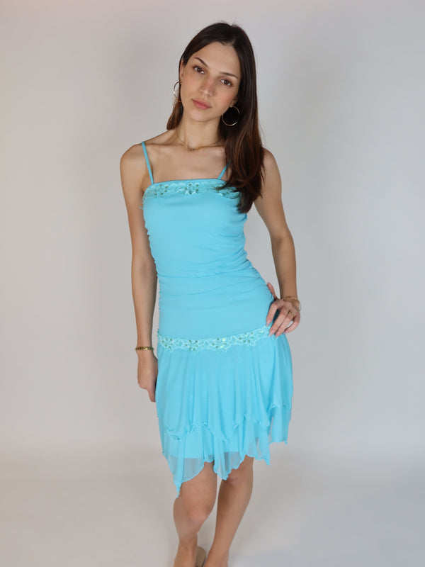 Vintage Y2K turquoise chiffon mini dress with beaded floral trim, sequin embellishments, spaghetti straps, and handkerchief hem skirt.