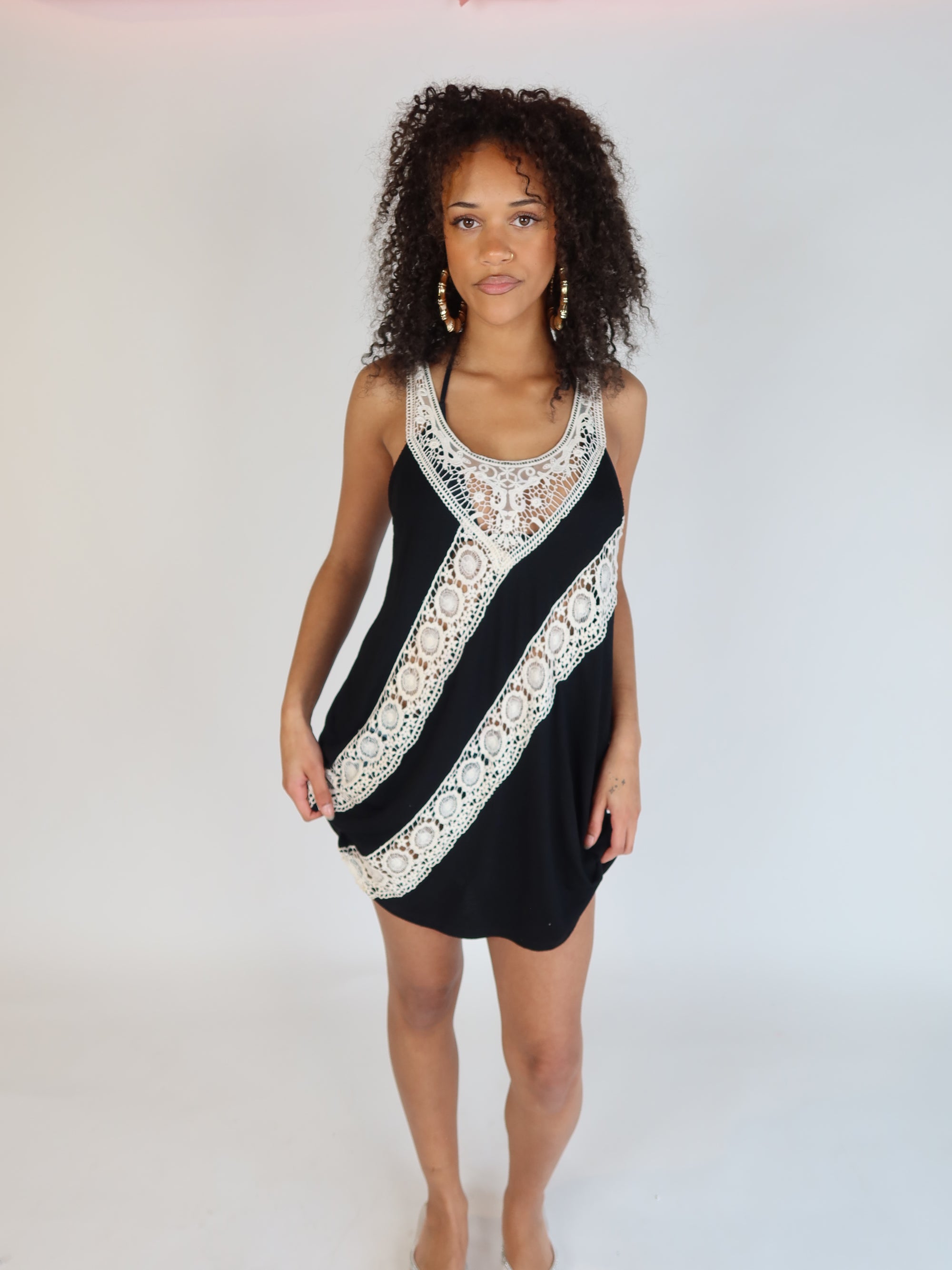 Vintage Y2K black halter mini dress with intricate ivory crochet lace detailing and bohemian-inspired silhouette.