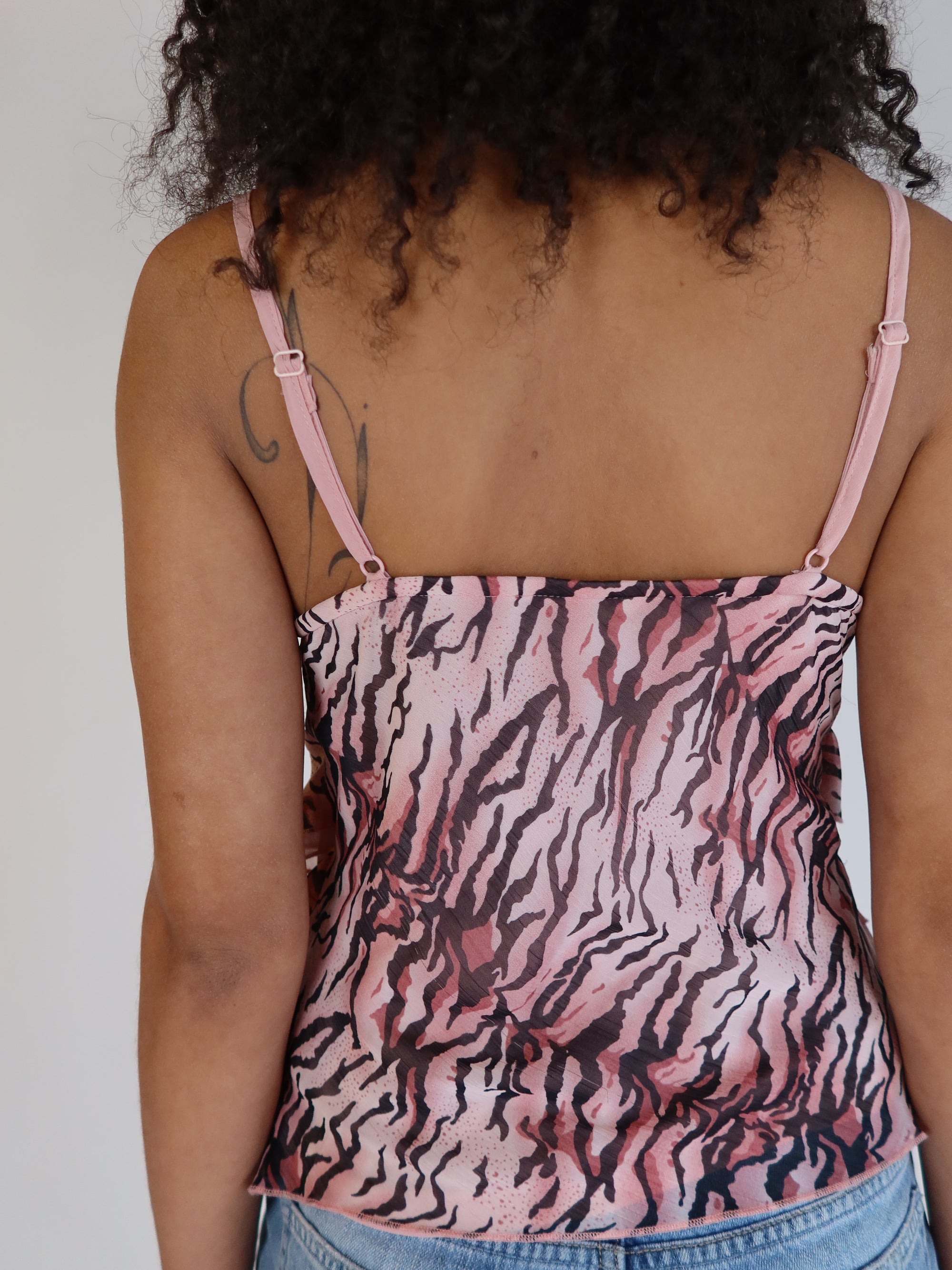 Authentic vintage Y2K pink zebra print mesh cami top with spaghetti straps, tiered silhouette, and surplice V-neck.