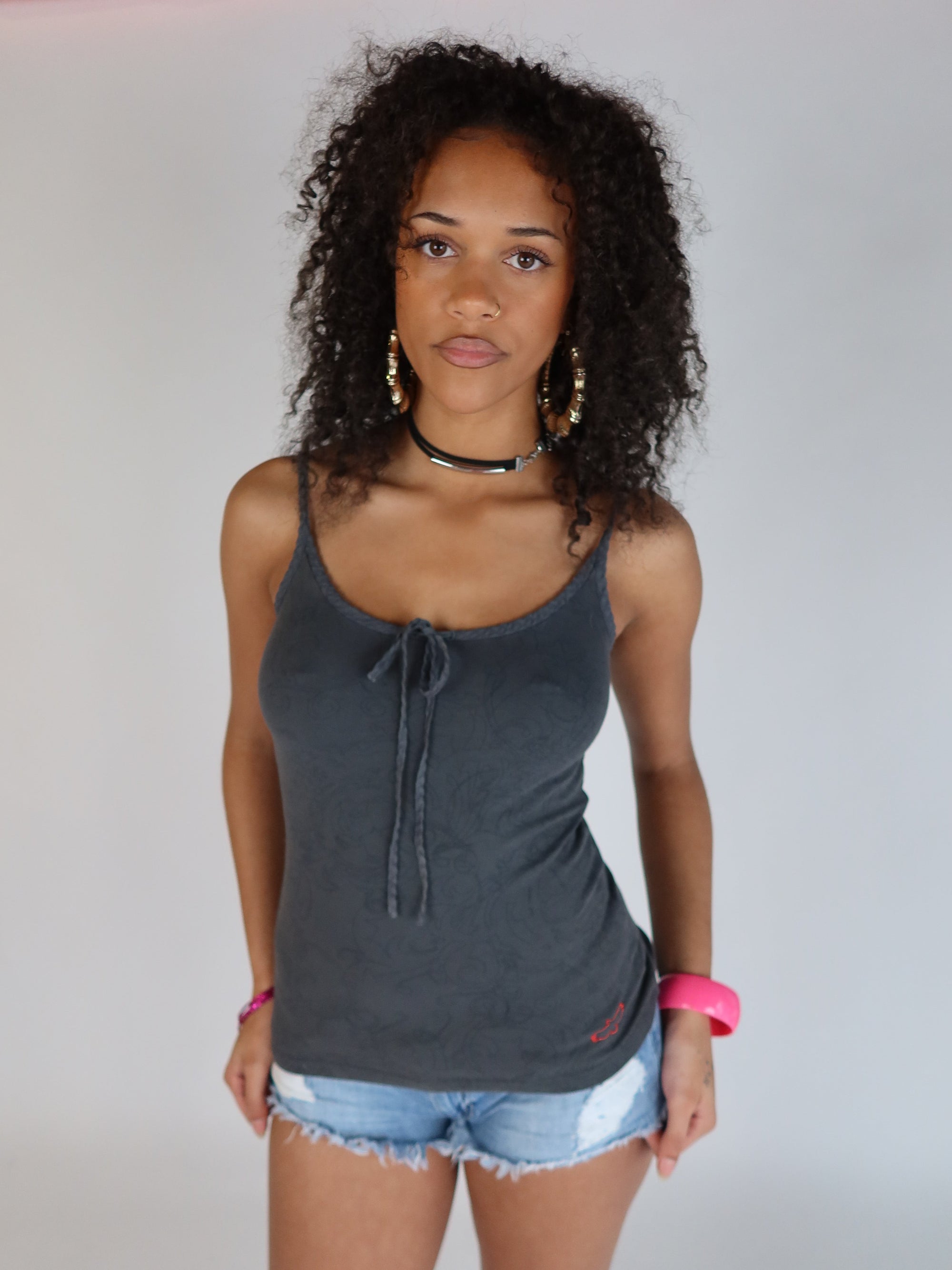 Vintage Y2K charcoal grey spaghetti strap cami top with a tie-front neckline, tonal graphic print, and fitted stretch silhouette.