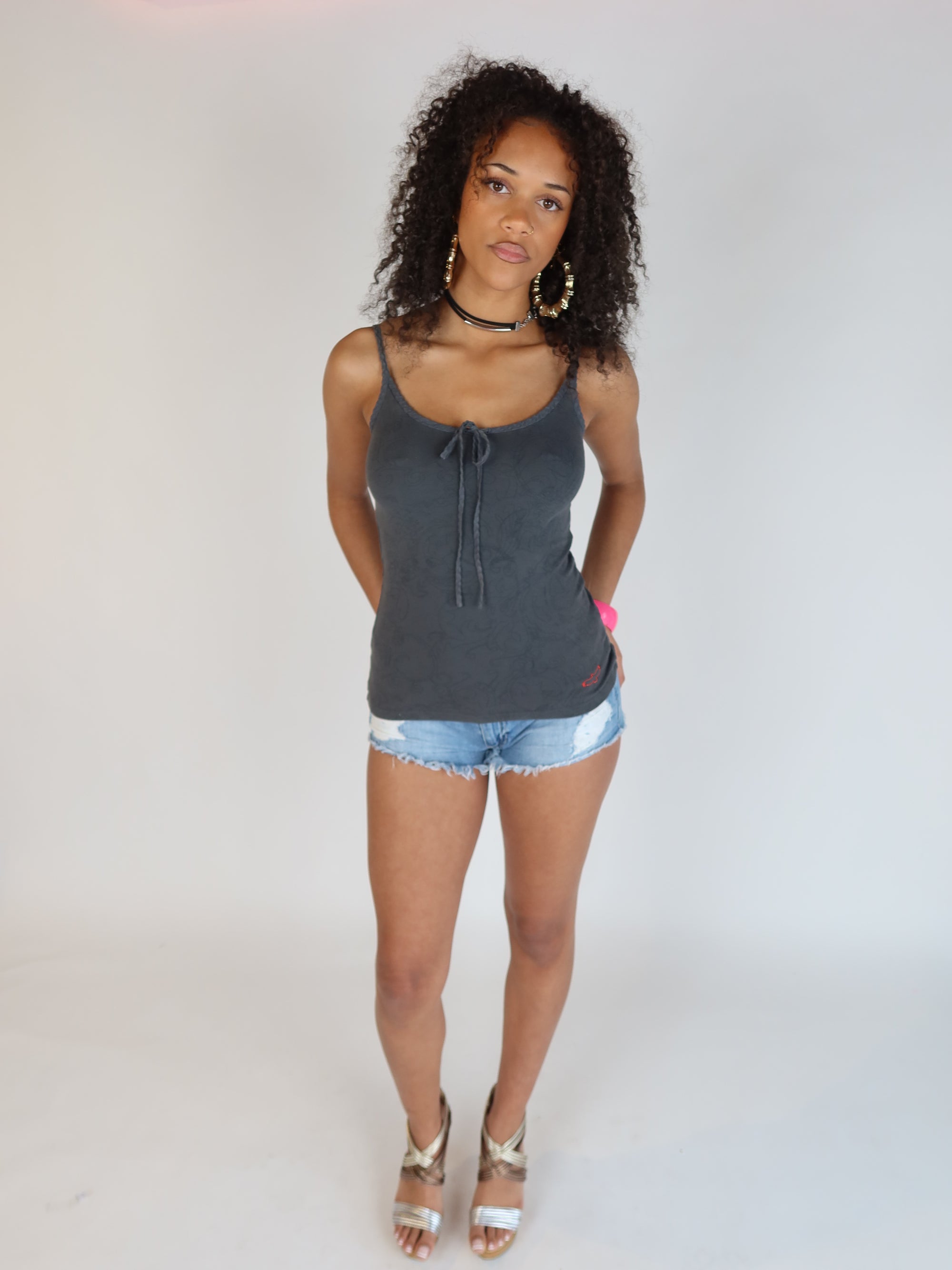 Vintage Y2K charcoal grey spaghetti strap cami top with a tie-front neckline, tonal graphic print, and fitted stretch silhouette.