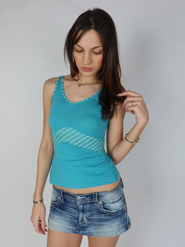 Authentic vintage Y2K turquoise blue tank top with striped underbust contrast panel and V-neckline, styled with a low-rise denim mini skirt.